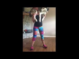 Woman Uses Helpful Husky for Weird Workout