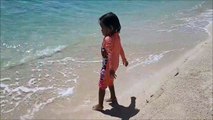Baby Playing Star Fish and Beach Sand - Donna The