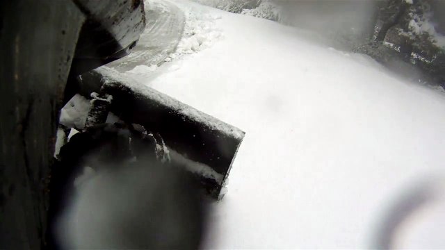 Polaris Glacier Pro Frame and 60 plow blade on 2015 RZR 900 EPS plowing a driveway.