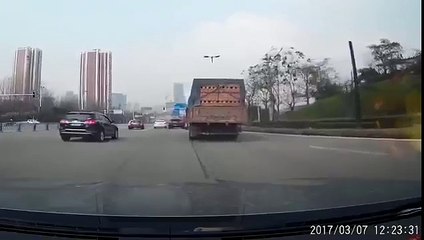 Truck Buries Car Under Load Of Bricks