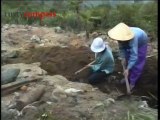 Kids digging for unexploded ordnance on Vietnam's Hai Van Pass in 1993