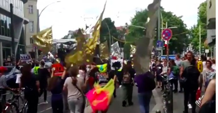 Berlin Artists With Sparkly Flags March to Protest Right-Wing Extremism