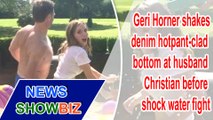 Geri Horner shakes denim hotpant-clad bottom at husband Christian before shock water fight