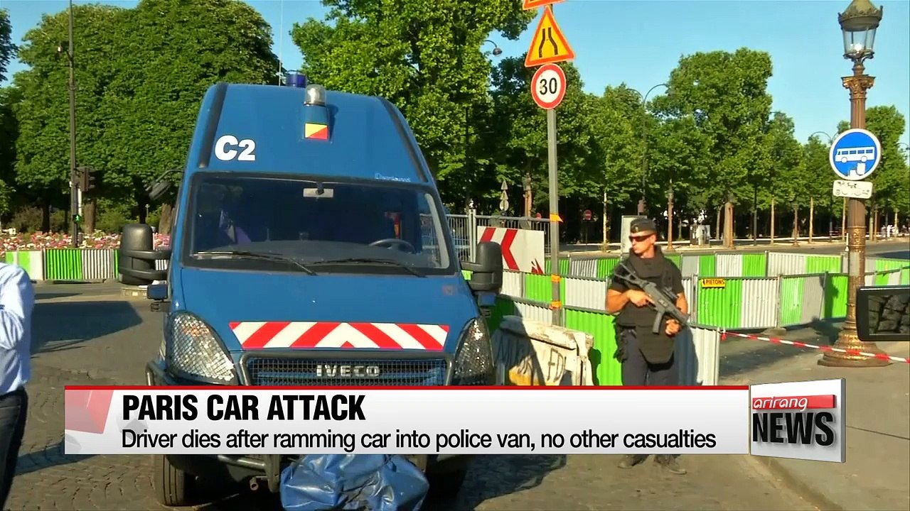 Car rams police van on Paris' Champs Elysees