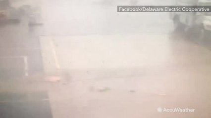 Surveillance camera shows debris from possible tornado flying around