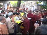Suu Kyi gives robes to monks and nuns