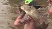 Catching Catfish With Bare Hands Makes for Epic Baby Gender Reveal