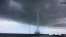 Three waterspouts whip up off the Florida coast as Cindy makes landfall