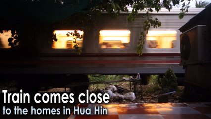 Train comes close to the homes in Hua Hin