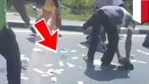 Video viral: perampok sebar uang curian untuk mengalihkan perhatian warga - TomoNews