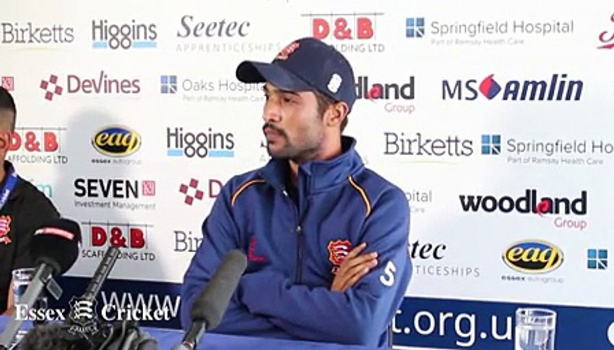 Mohammad Amir makes a funny gesture with reporter