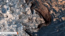 Inverted Mars Crater Looks Like Waves Crashing Against 'Cloud-Covered Cliff Edge'