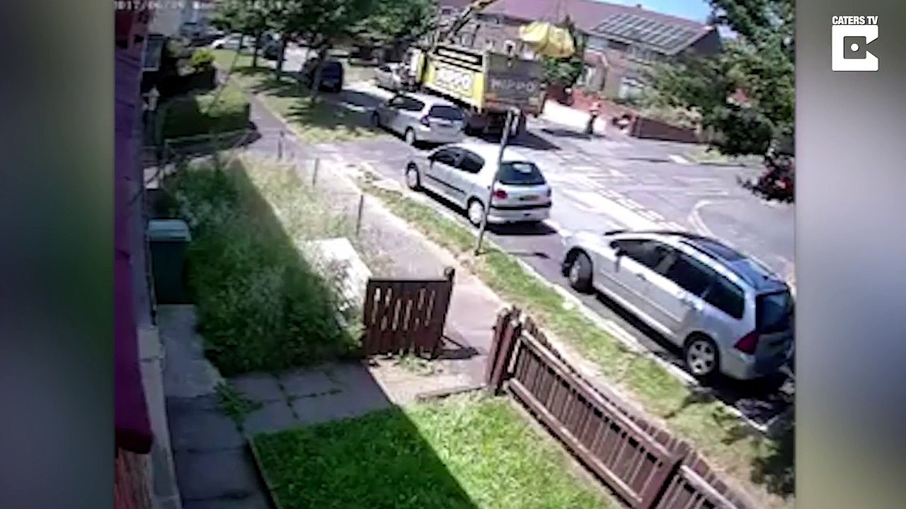 Disposal Truck Falls Over And Crushes Car