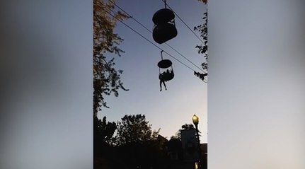 Teen dangles from Six Flags ride as crowd gathers to catch her