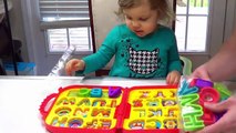 Cute Kid Genevieve Teaches 123s and ABCs with Cookie Monster & Elmos On the Go Alphabet