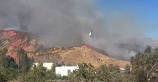 Air Tankers Drop Water on Growing Mart Fire in Highland
