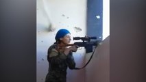Female Kurdish fighter laughs after nearly being shot by Isis sniper