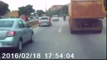 Lucky Biker escapes from being crushed by truck after hitting man in the middle of a highway, Brazil