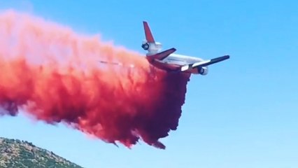 Plane drops retardant on Arizona fire as governor declares state of emergency