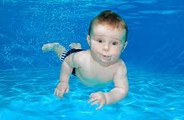 Baby Swimming In The Pool