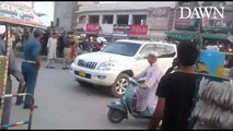 Lahore traffic wardens and dolphin force workers hitting the car