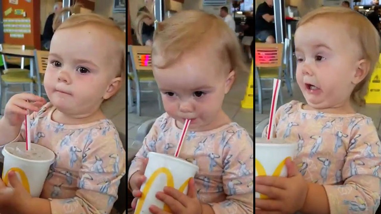 Une enfant goûte du Coca-Cola pour la première fois