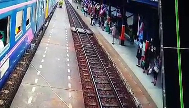 Railway Workers Hold Back Woman From Tracks