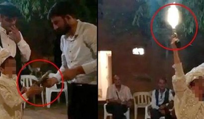 Sünnet çocuğunun eline silah verip, havaya ateş ettirdiler