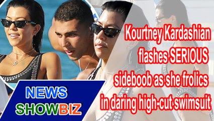 KOURTNEY KARDASHIAN flashes SERIOUS sideboob as she frolics in daring swimsuit | NEWS SHOWBIZ