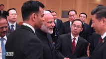 Modi, Xi smile, shake hands, discuss issues
