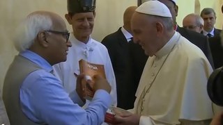 Mr. Sudheendra Kulkarni presents Dr Muhammad Tahir-ul-Qadri’s book “FATWA ON TERRORISM AND SUICIDE BOMBING” to Pope Fran