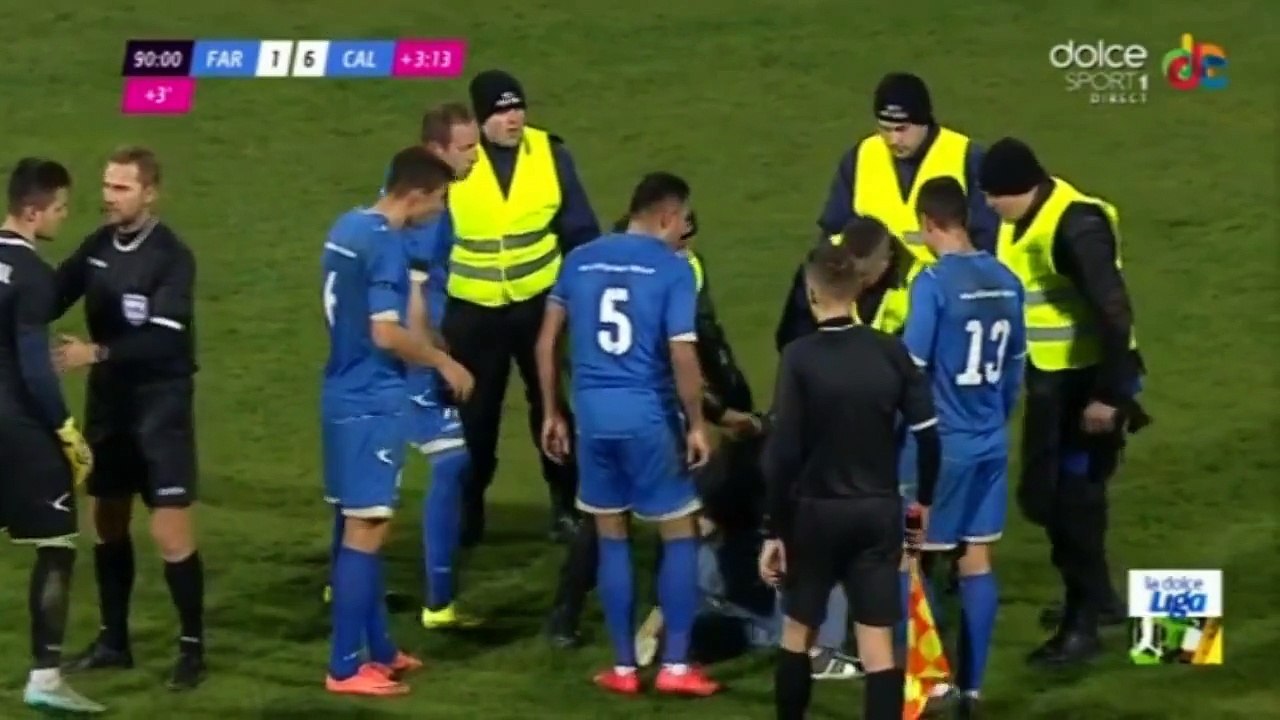 Goalkeeper fighting with a fan during a football game in Romania