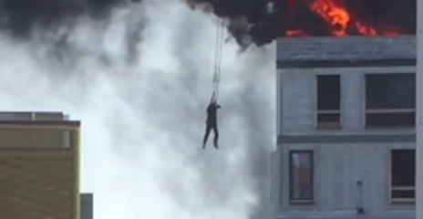 Man Escapes Burning Building by Holding on to Crane Hook