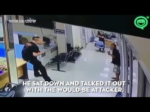 Thai police officer disarms man with knife with a hug | Coconuts TV