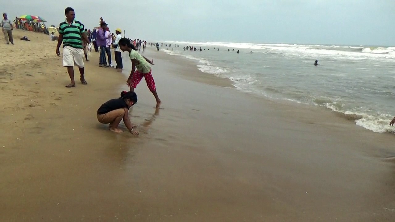 A cute baby playing with sea