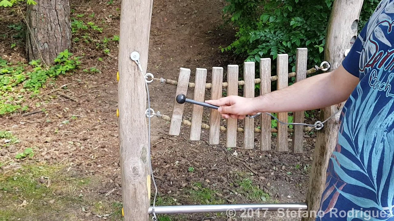 Making sounds on Wooden Xylophone on the Playground