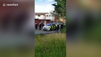 Police car turned onto its roof by 'gang' in Kirkby, UK