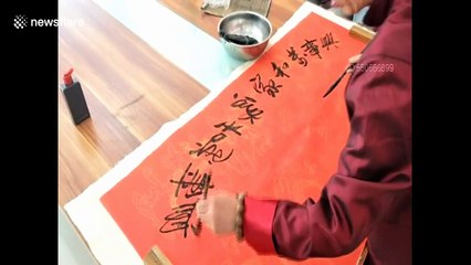Man shows off his amazing calligraphy skills