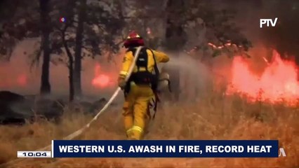 Western US awash in fire, record heat