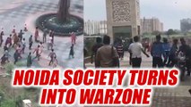 Noida : Mahagun society in sector 78 tunes into war zone, Watch Video | Oneindia News