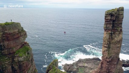 Daredevil Alexander Schulz performs first high wire walk to sea stack in Scotland