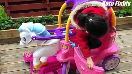 Baby Minnie playing with her new pink horse carriage by little tikes