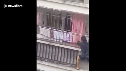 Man rescues four-year-old girl dangling from balcony