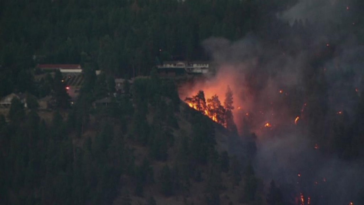 Tens of thousands of people evacuated as wildfires continue to sweep across British Columbia