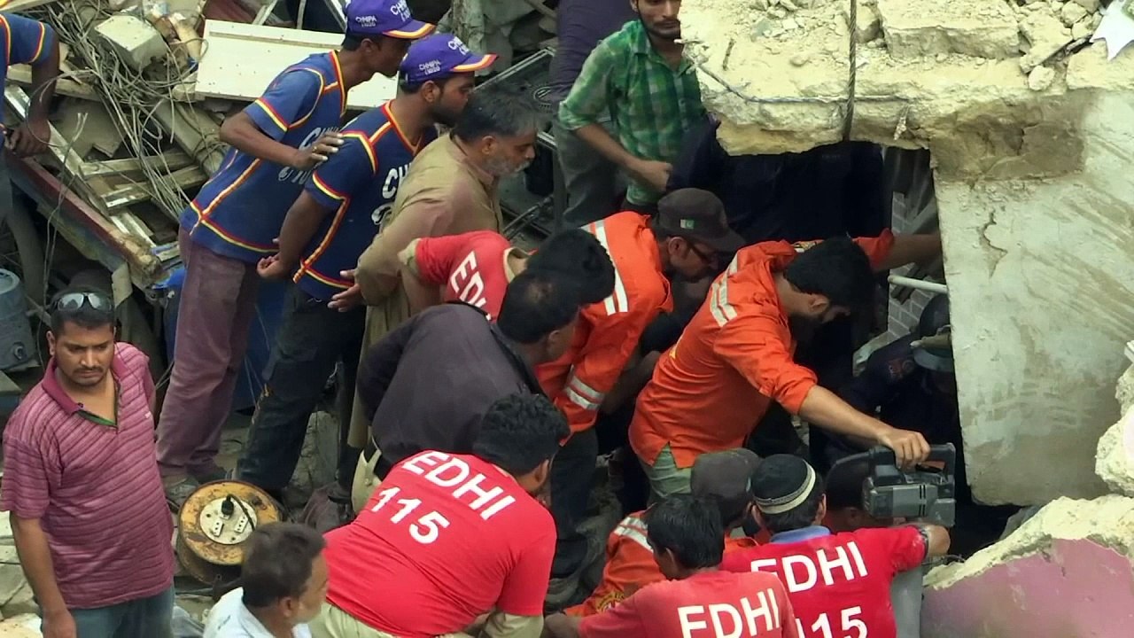 Two killed as building collapses while residents sleep