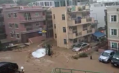 Floodwaters Fill Courtyard in Hong Kong's Tai Po District