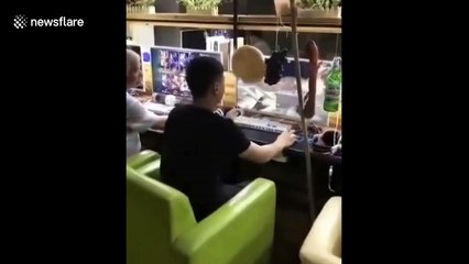 Addict gamer hangs food by computer so he can keep playing