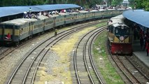 Crossing between Kishoregang Express and Upokul Express Train at Airport Railway Station / Bangladesh Railway