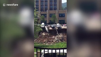 Vehicles plunge when riverbank collapses