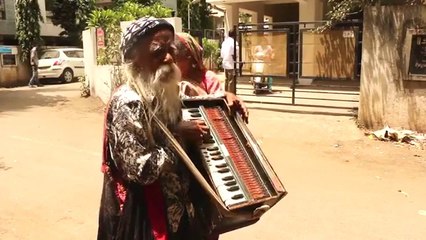 Street Singer.. The Old Man and The Harmonium